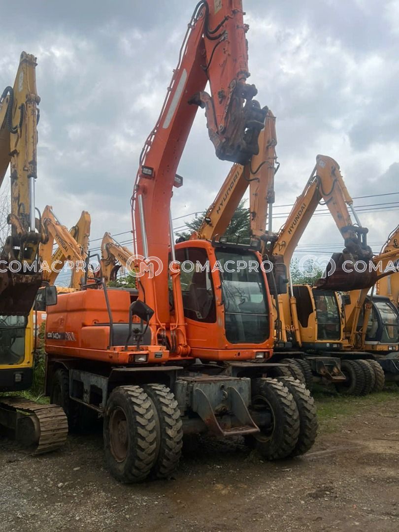 Máy xúc bánh lốp DOOSAN DX140 - 2016