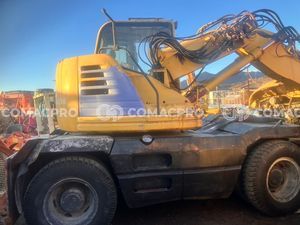 Máy xúc bánh lốp KOMATSU PW128UU-1