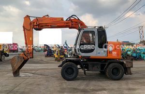 Máy xúc bánh lốp HITACHI EX125WD-5 - 1999